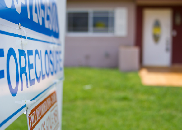 House with a foreclosure sign outside